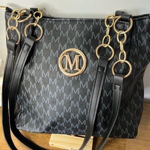 Black/navy M Monogram Tote Bag with Gold tone Hardware.